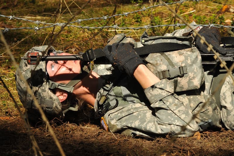 Goodell low crawls under barbed wire