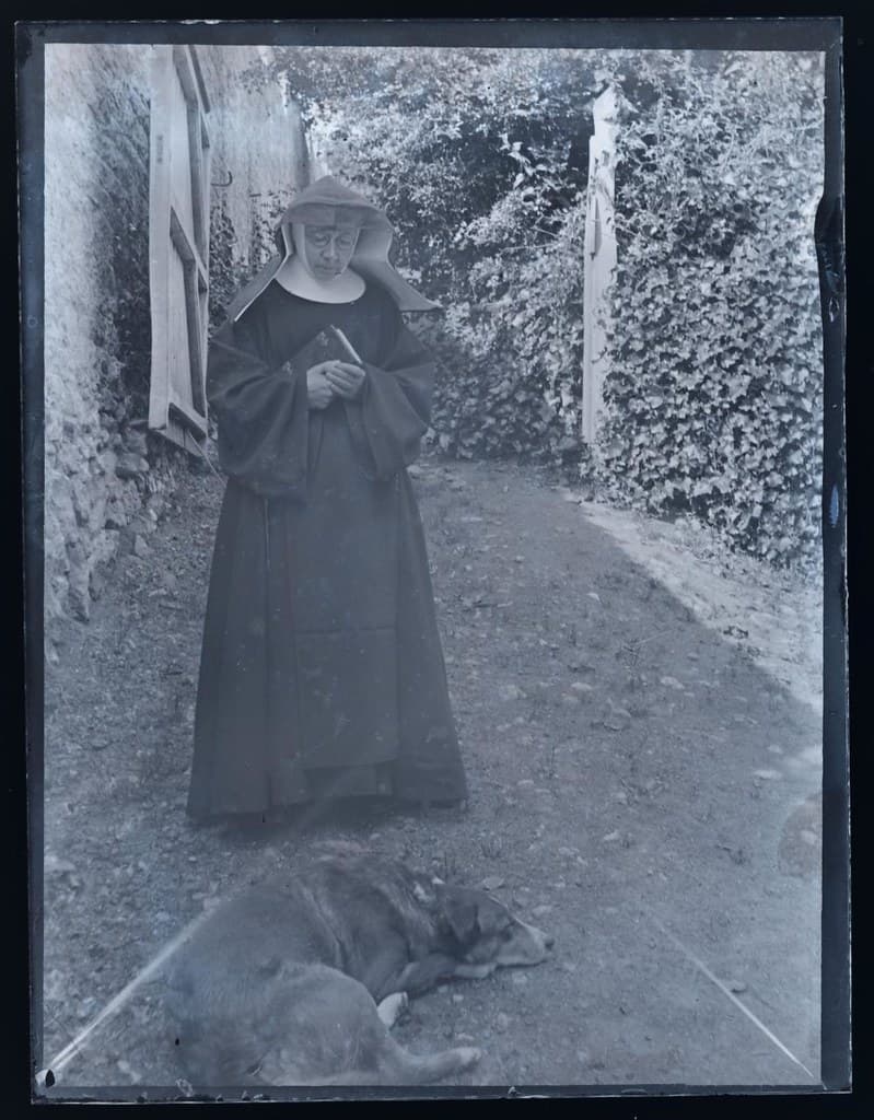 Portrait of a nun and dog