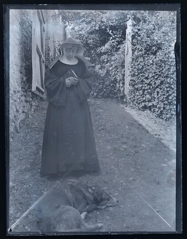 Portrait of a nun and dog