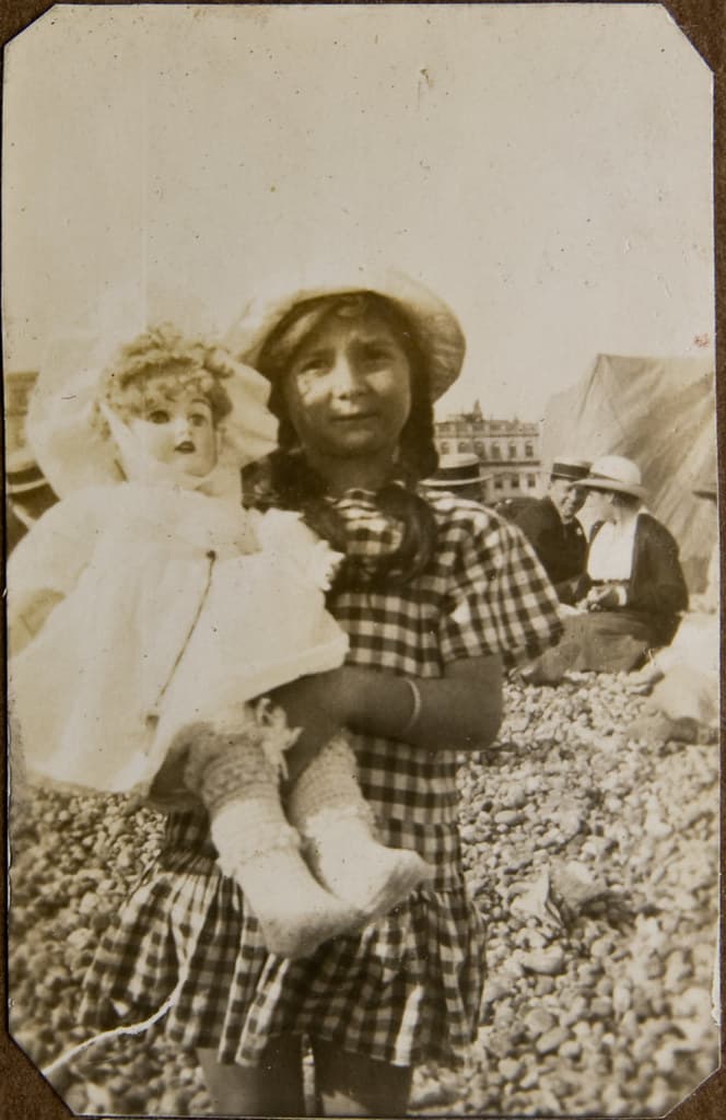 Girl with her beautiful doll, Brighton beach ca 1915