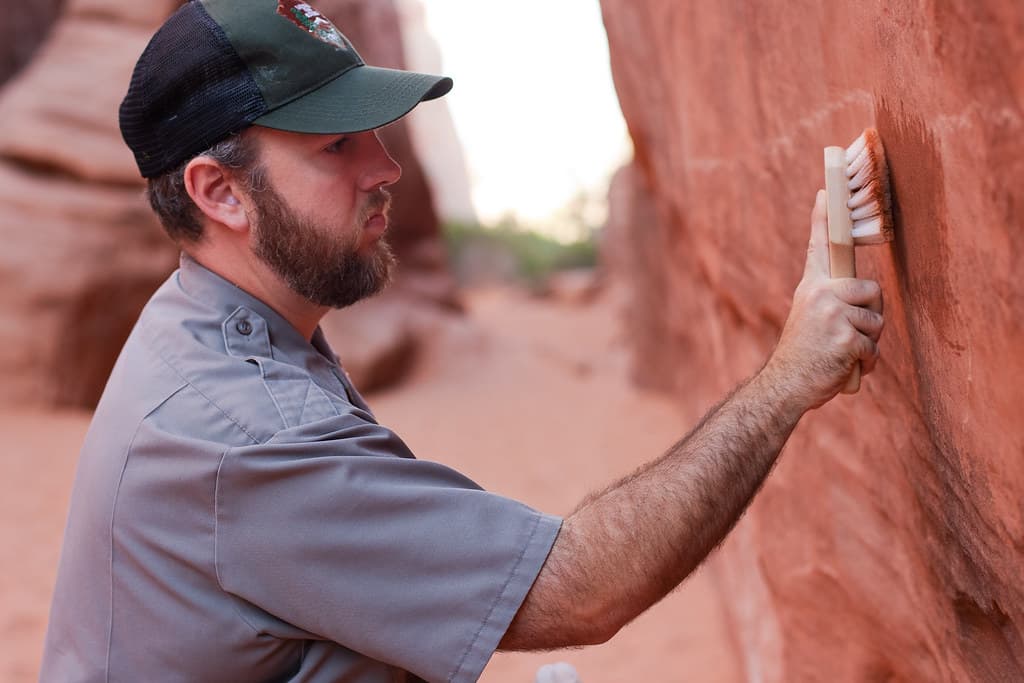 Stephen Allen removes graffiti