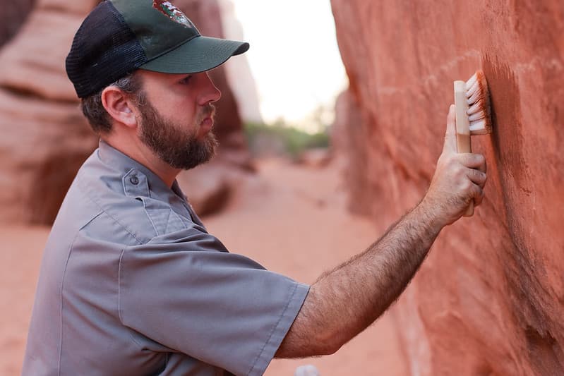 Stephen Allen removes graffiti