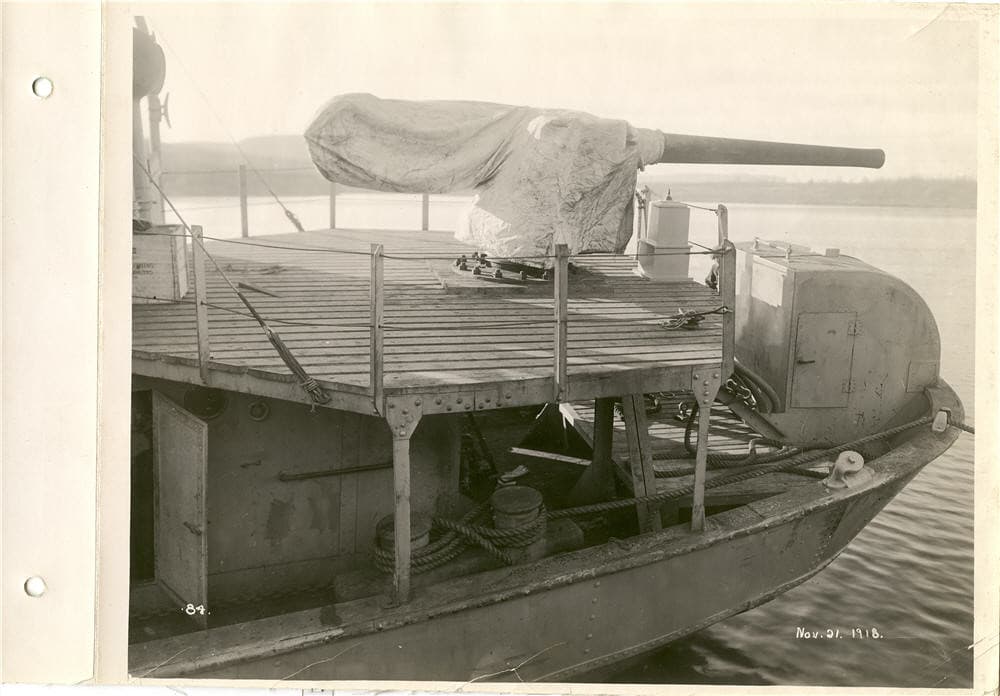 Gun at stern of boat being equipped