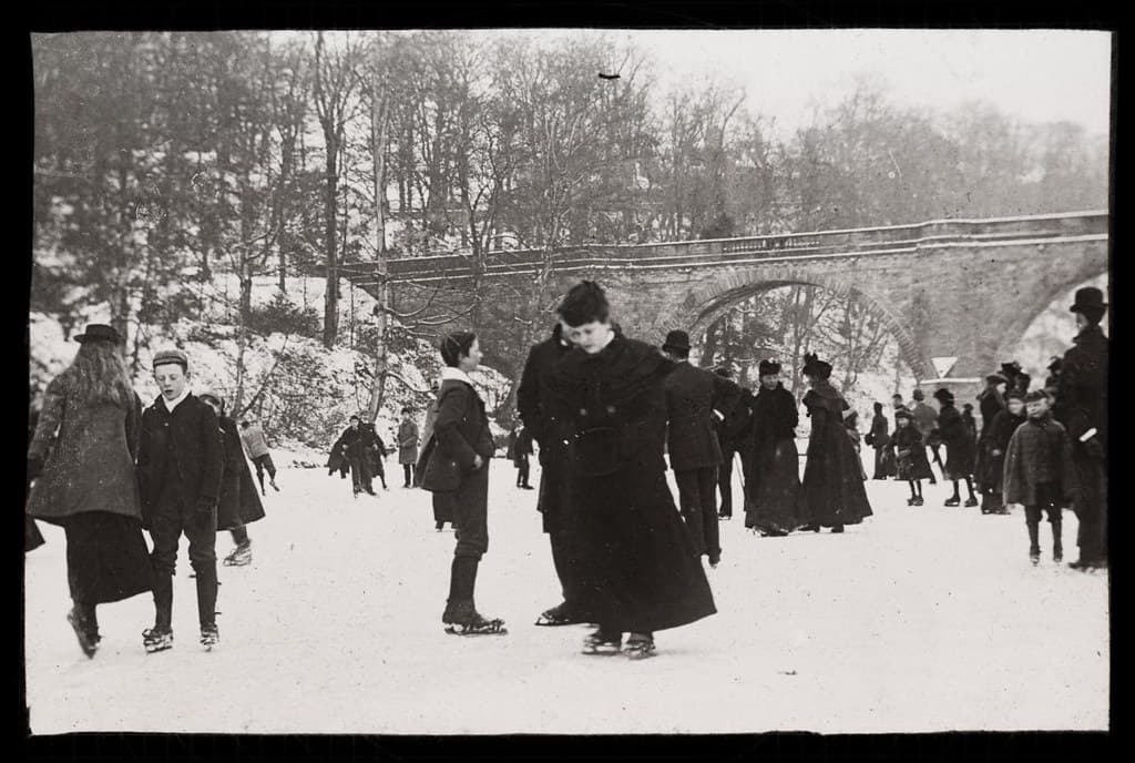 Ice skating on a frozen river, ca 1900