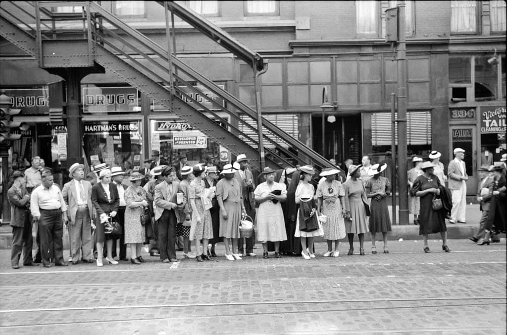 One for All: Waiting for a street car in Chicago, Illinois, 1940.