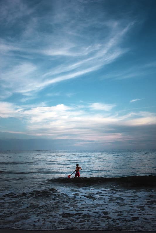 Male in Ocean Under Blue Sky