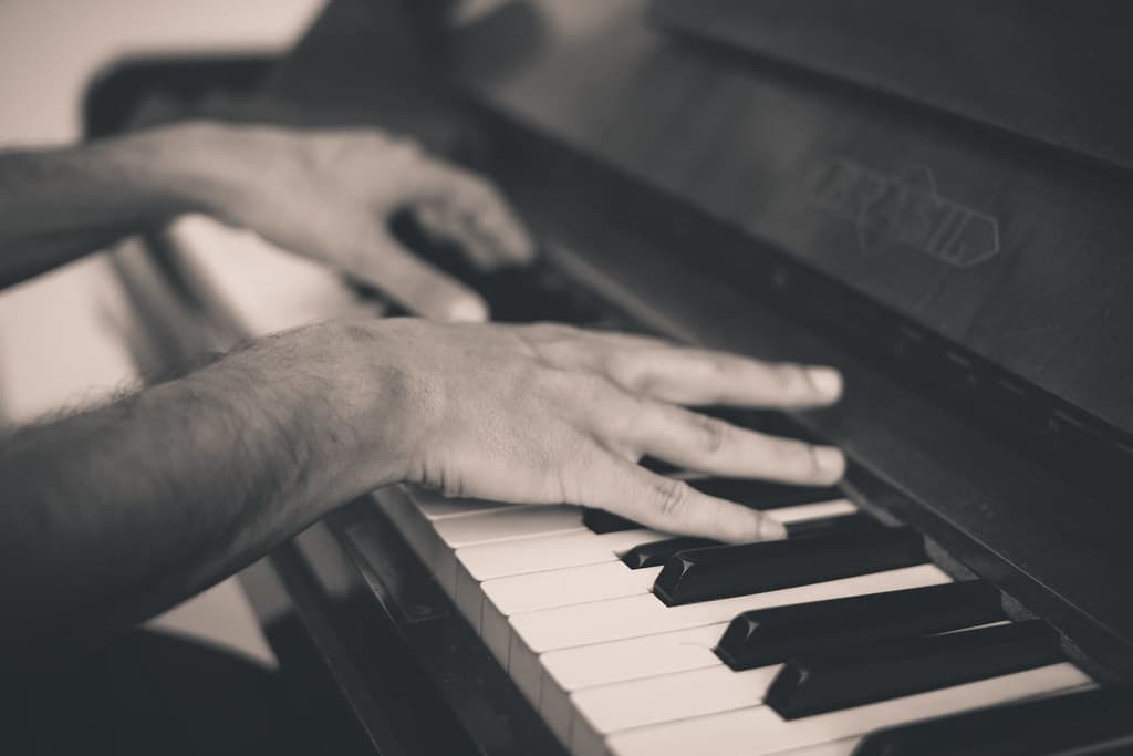 Hands and Fingers on a Piano Keyboard