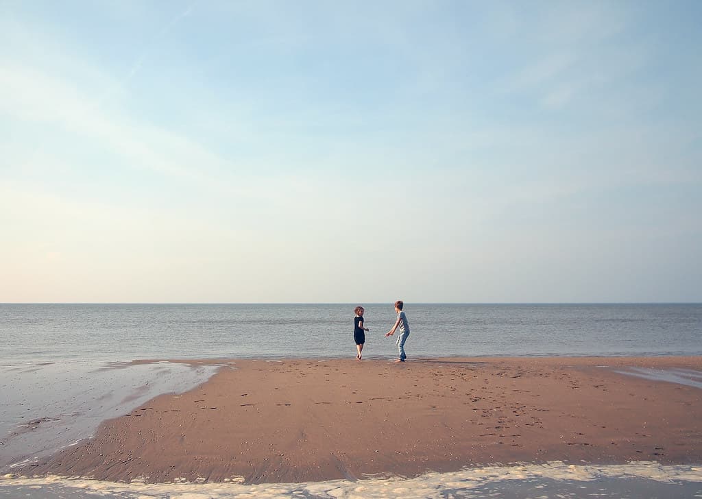 Two Children Playing on a Beach