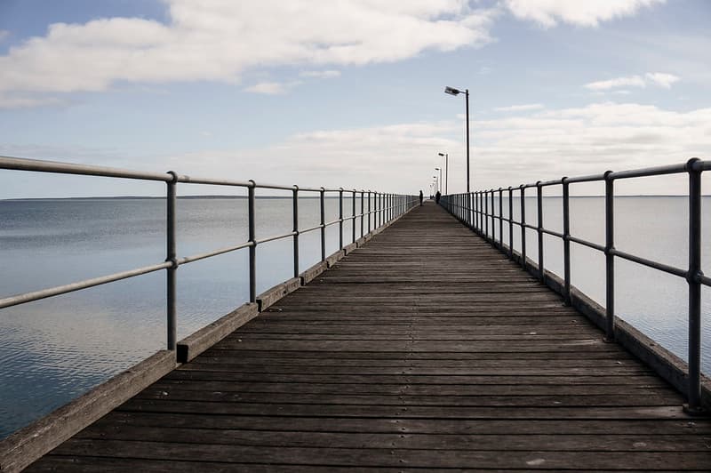 People on Pier with Wooden Deck
