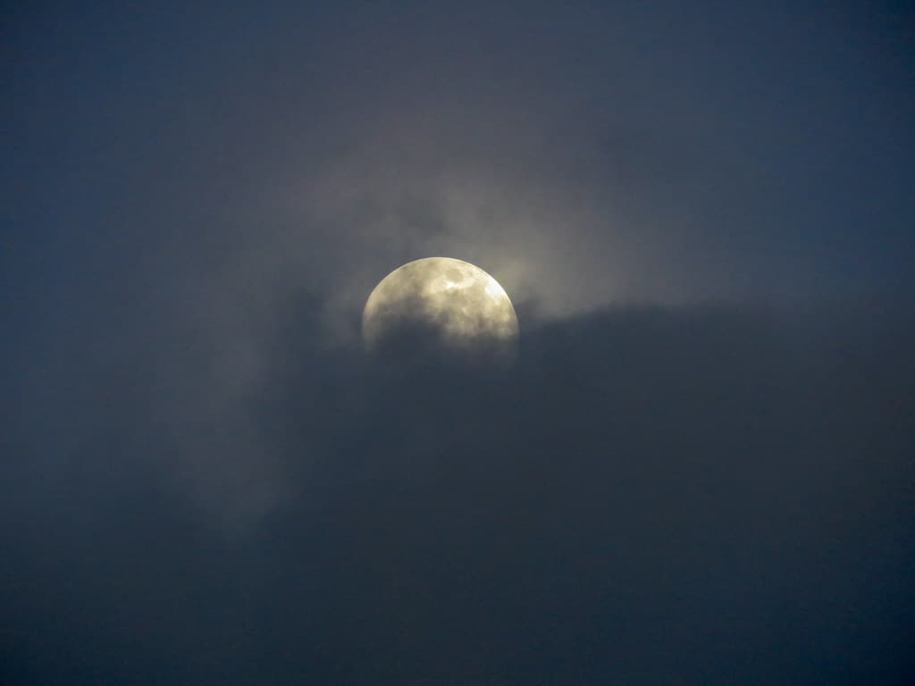 Full Moon Hidden Behind Clouds