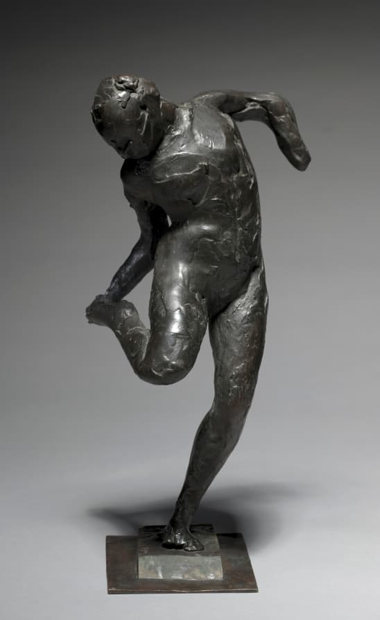 Dancer Looking at the Sole of her Right Foot