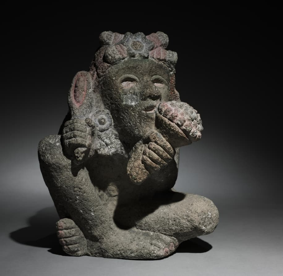 Seated Male Carrying Maize