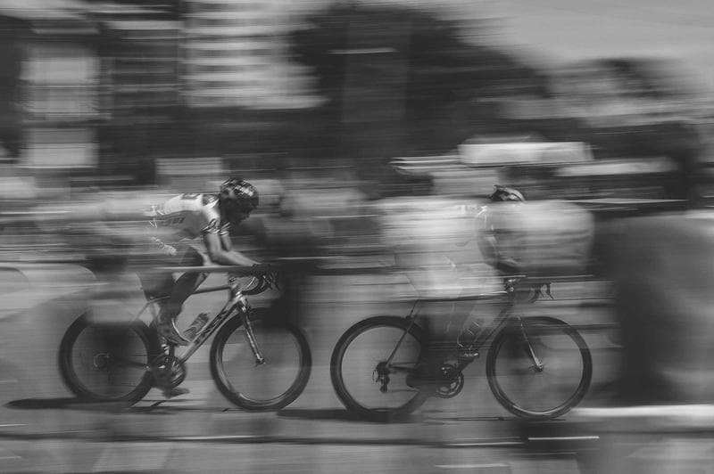 Cyclists, moving