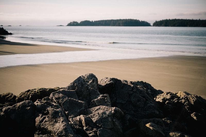 Rocks on a pale beach