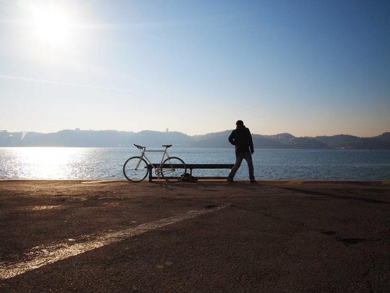 Walking a bike on the sand