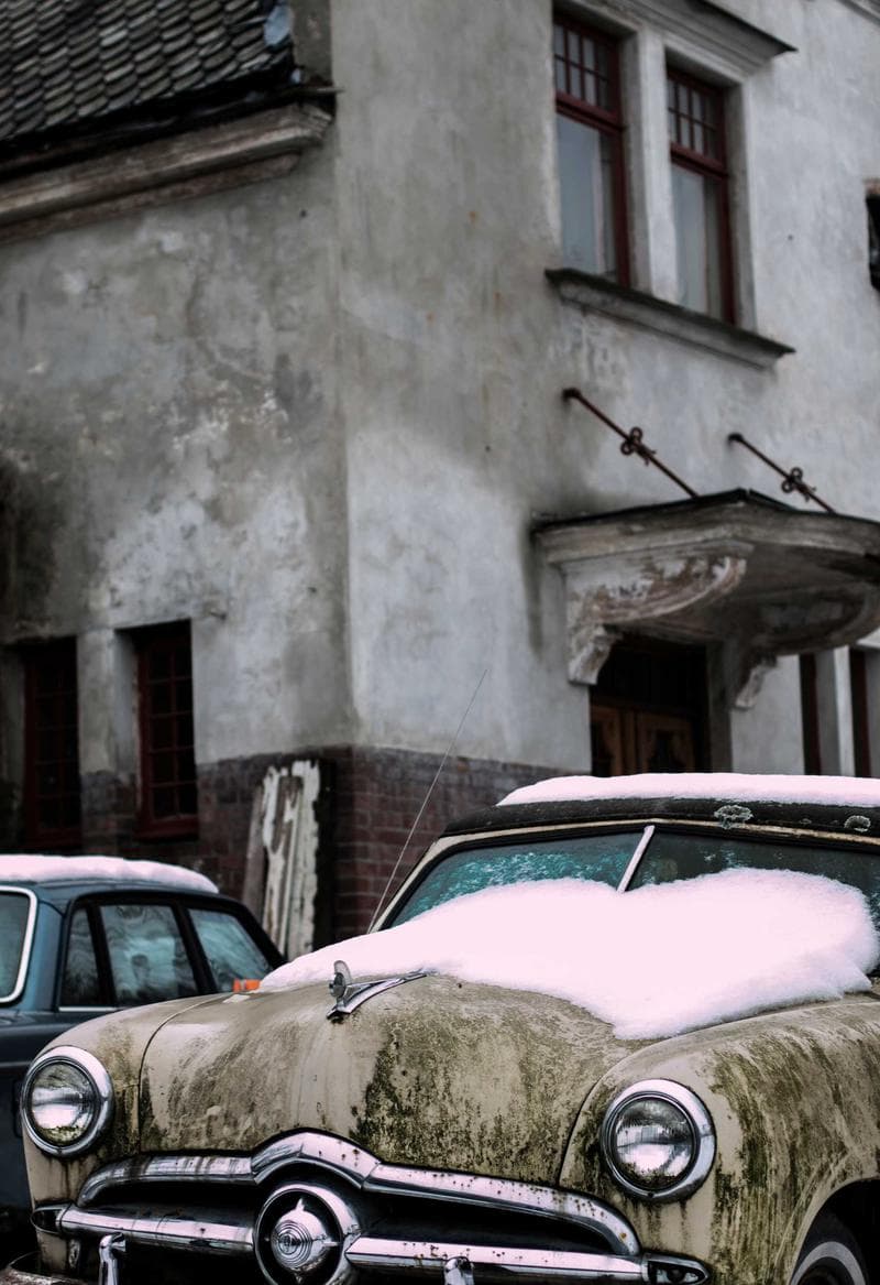 Car by a wall