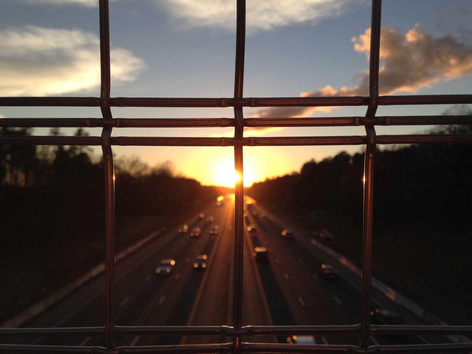 Sunset through a railing