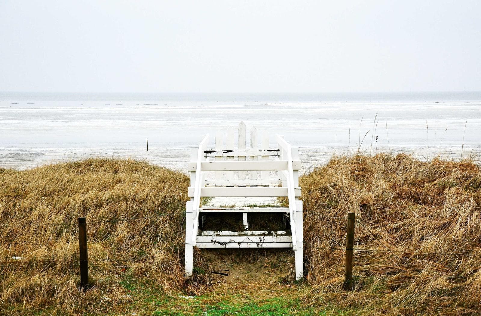 White bench in the dunes
