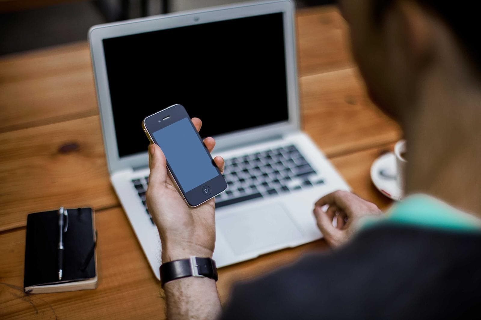 Phone beside a laptop