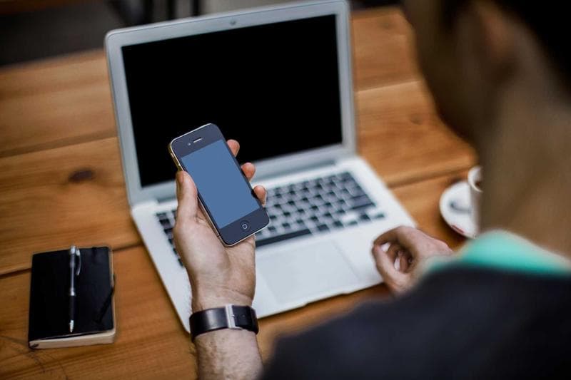 Phone beside a laptop