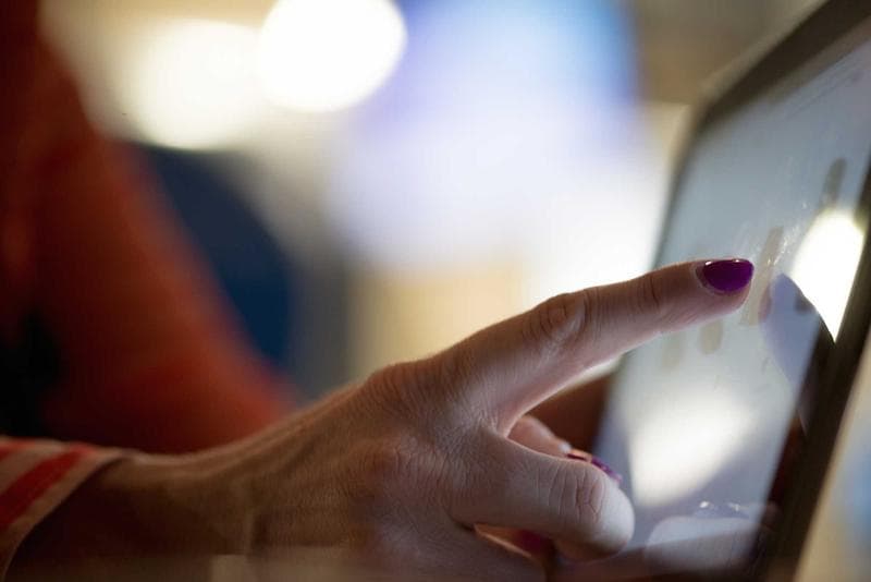 A hand on a screen