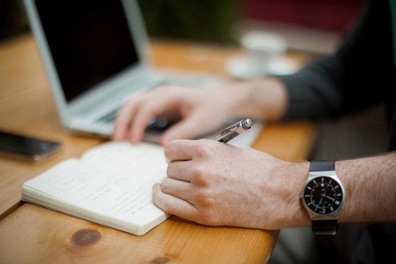 Writing in a notebook