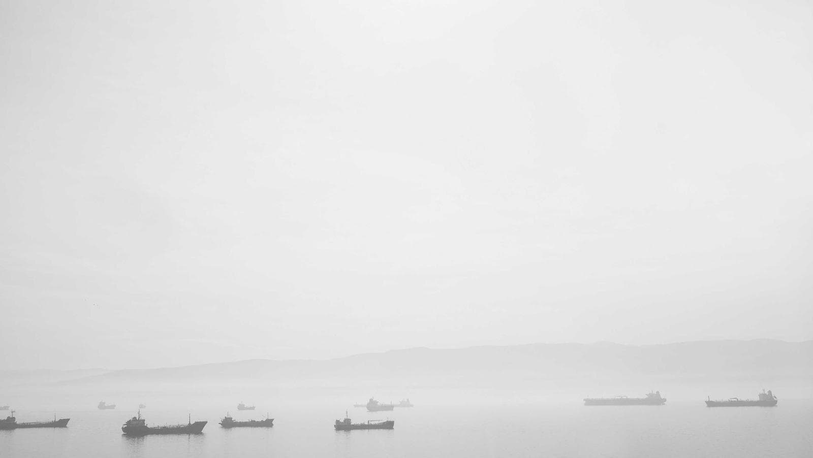Boats on a pale lake
