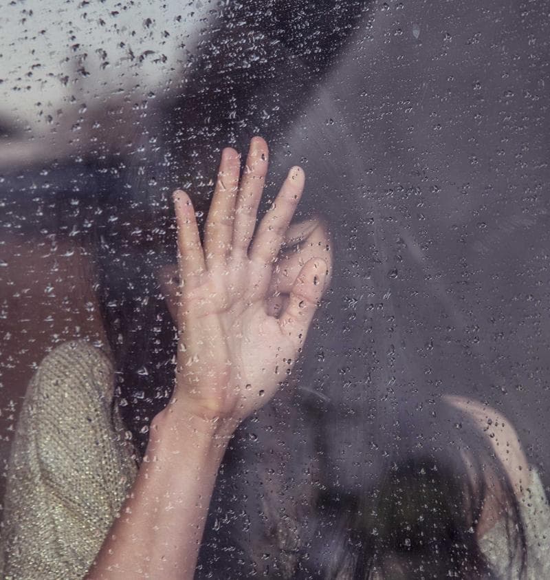 Hand on wet glass