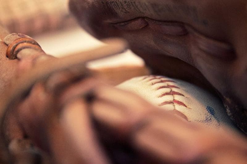 Hands and a baseball