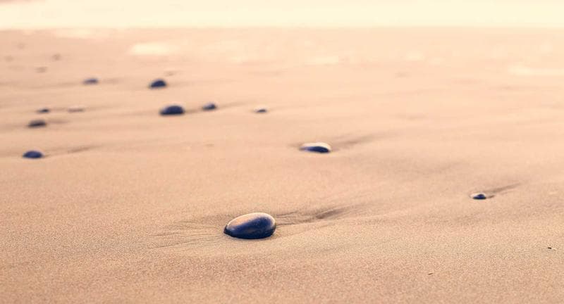 Stones on sand