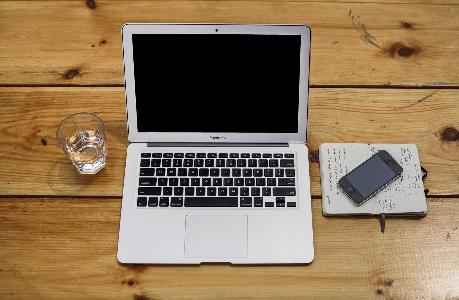Open laptop on wood