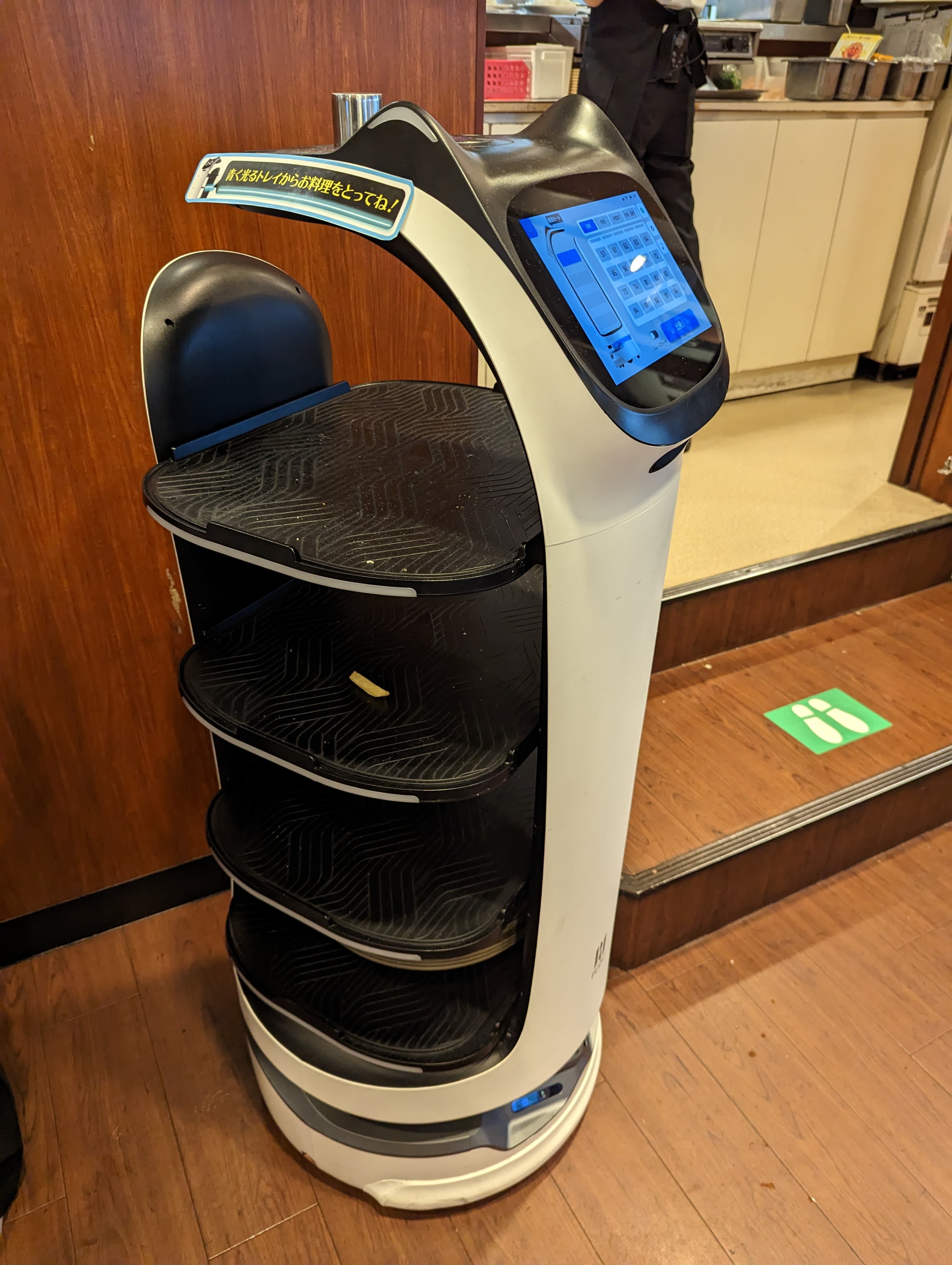 Robot serving dishes to customers at Japanese restaurant "Gusto"