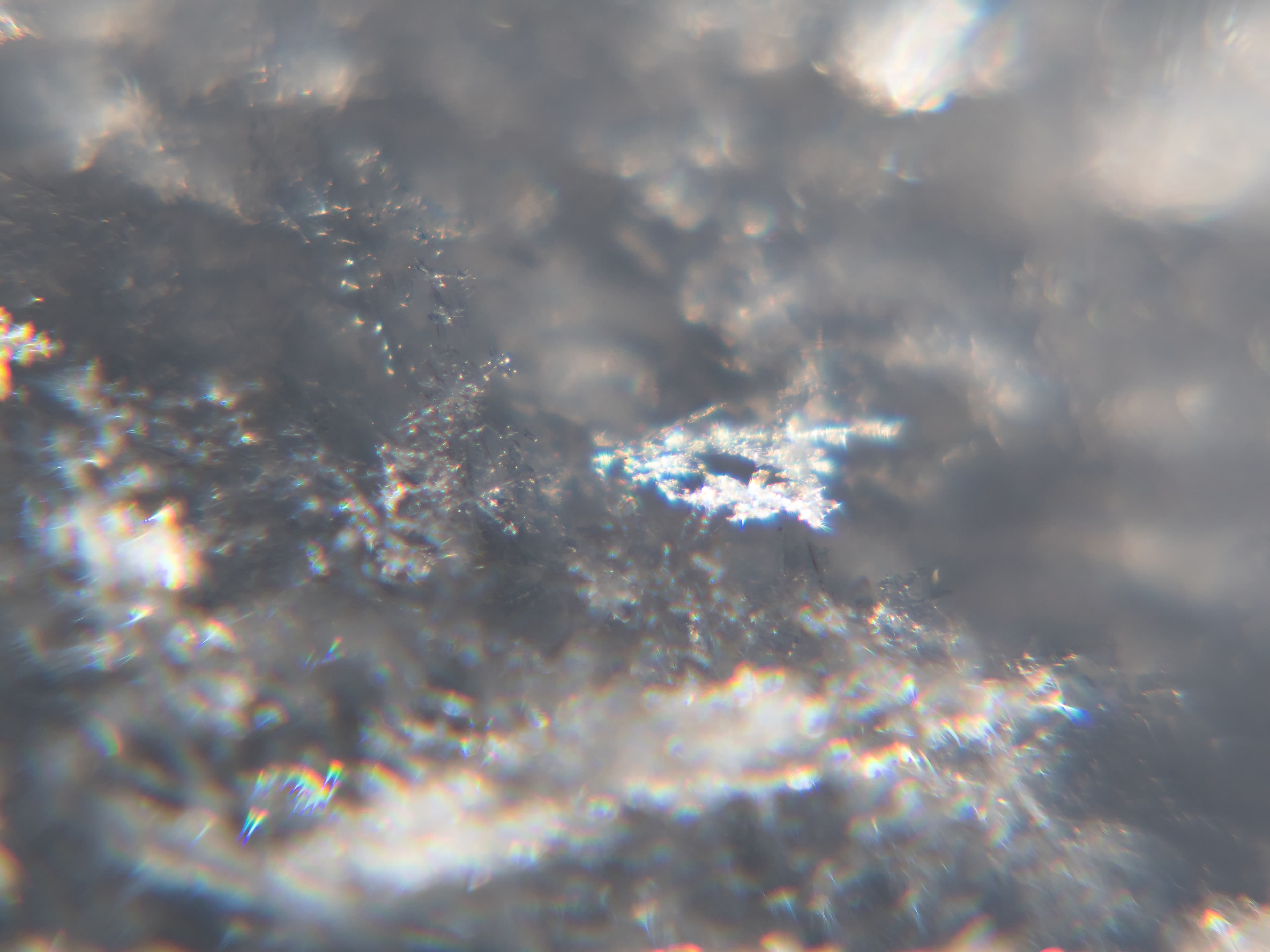 Snow crystals glittering in strong direct sunlight 20