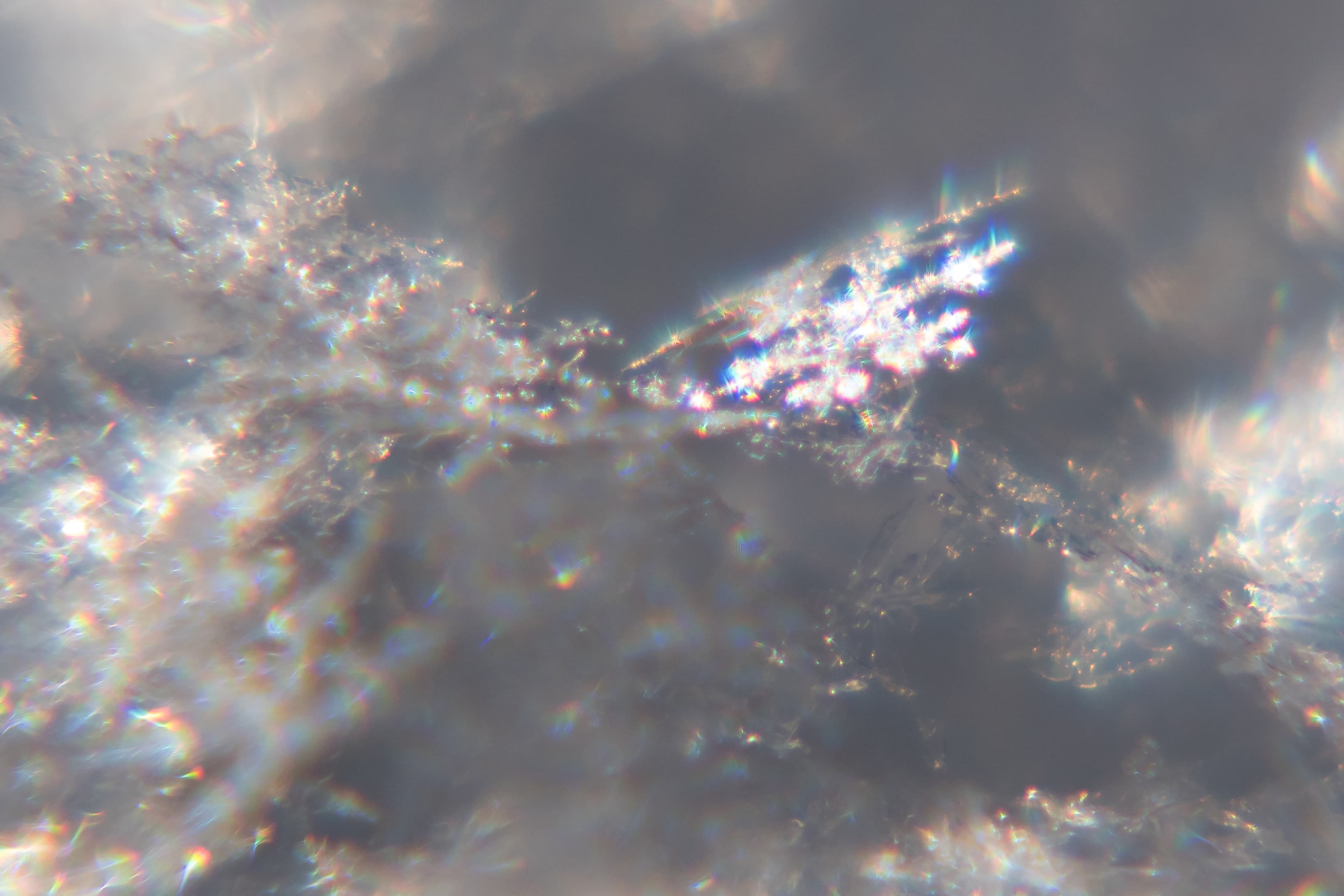 Snow crystals glittering in strong direct sunlight 43 - cropped