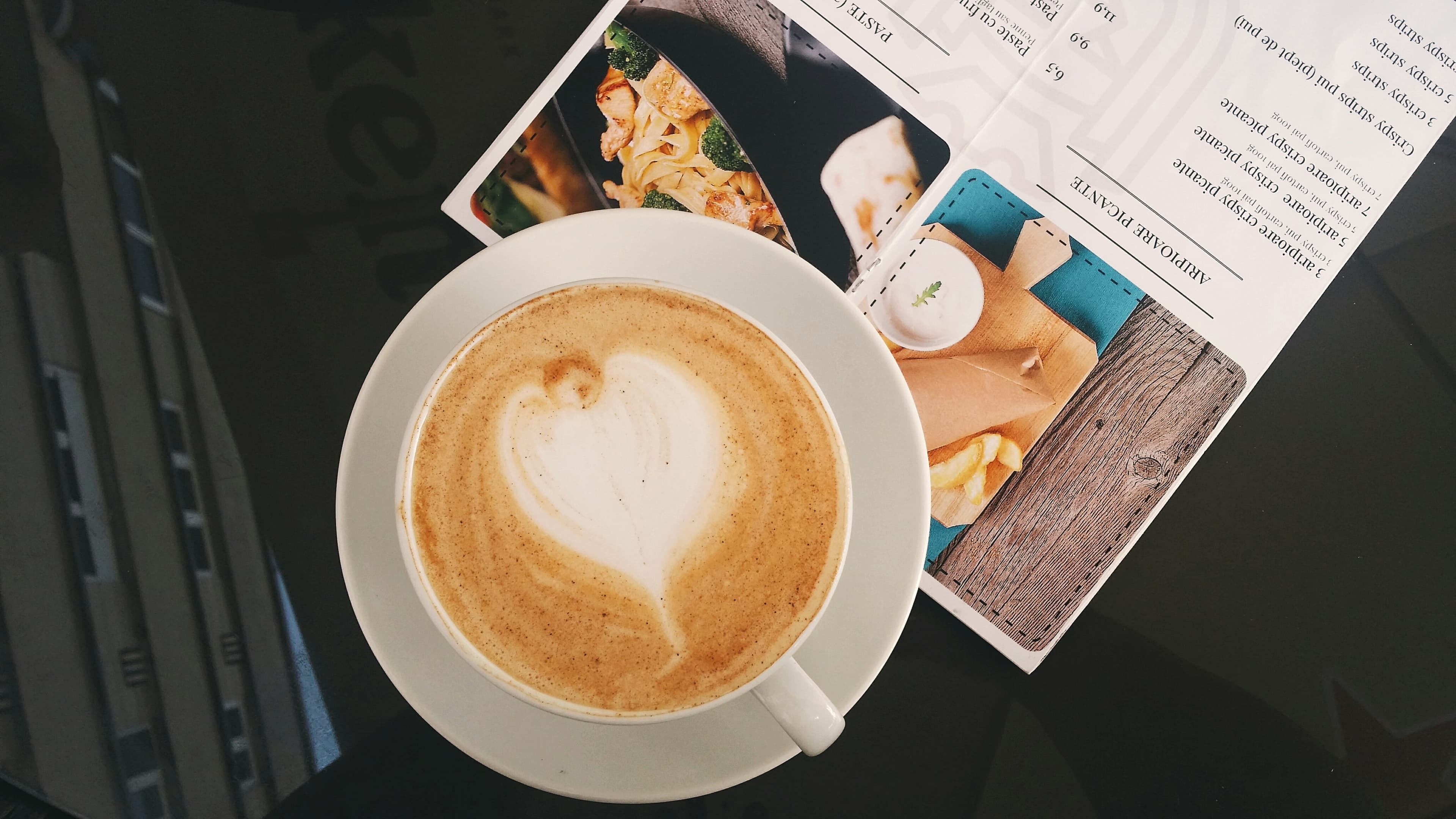 Coffee and recipe on a table (Unsplash)