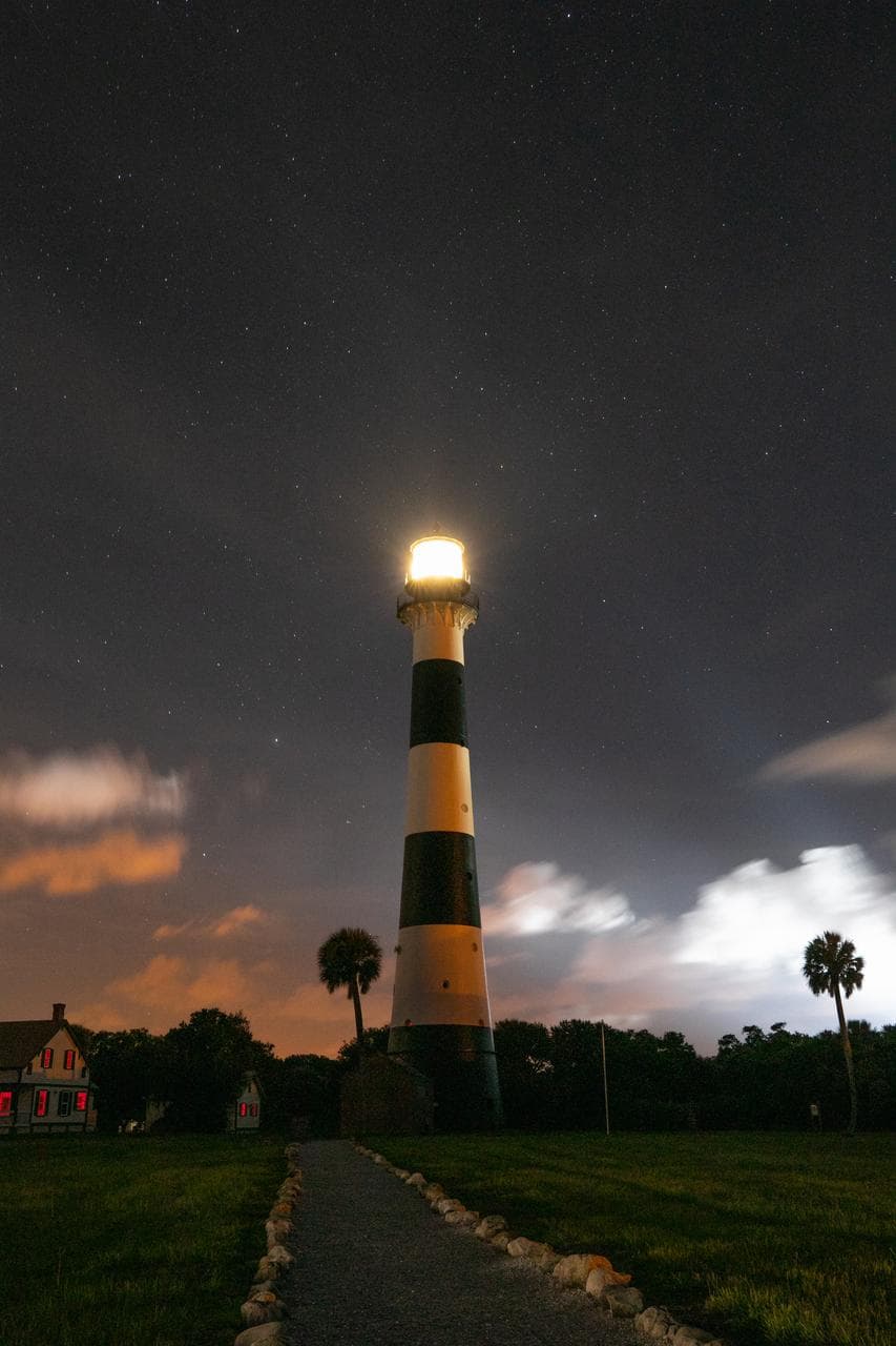 Creative Photography - Stars, Clouds, and Lighthouse