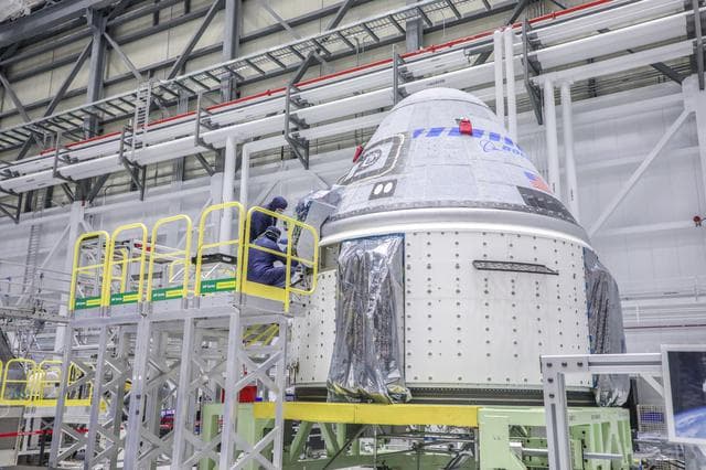 Starliner Technicians Working On OFT-2 Vehicle