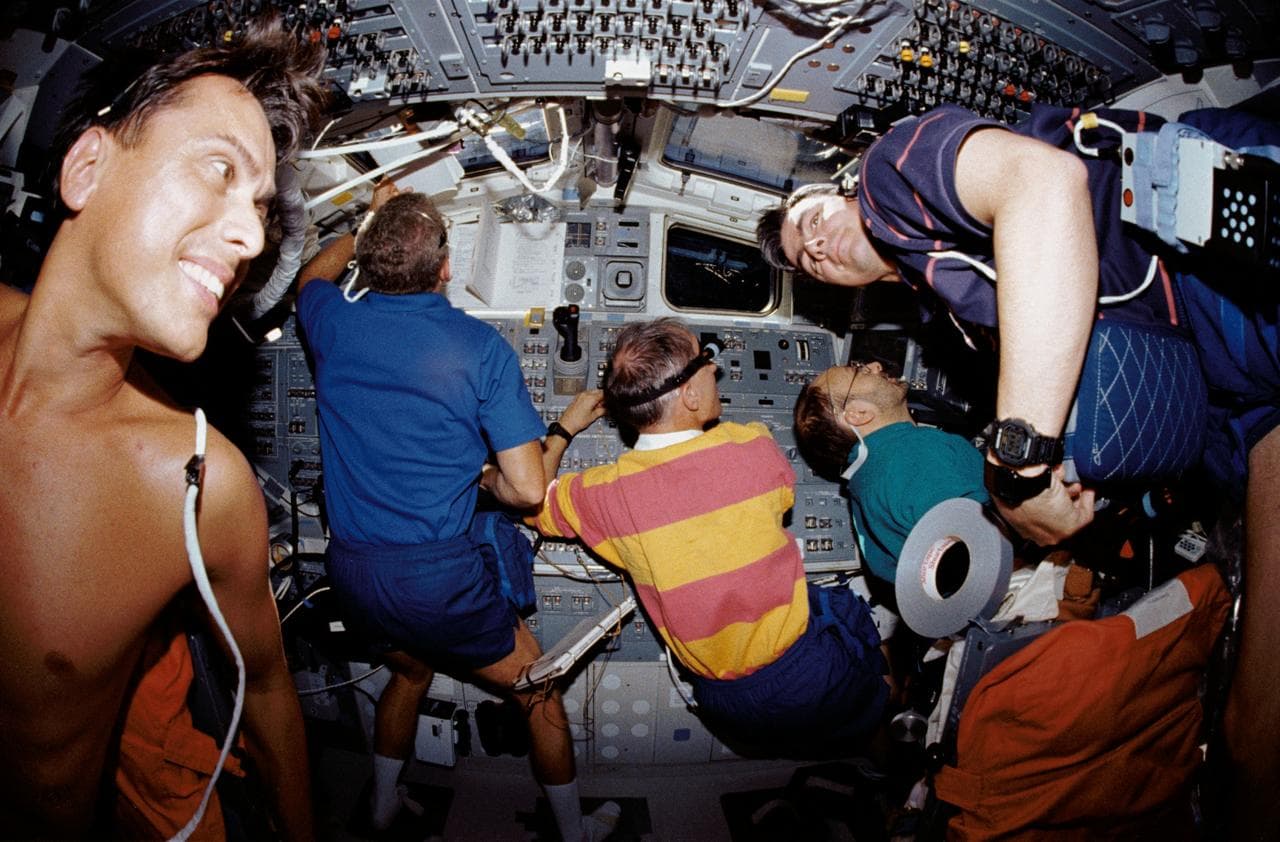 STS-46 crewmembers work on OV-104's aft flight deck