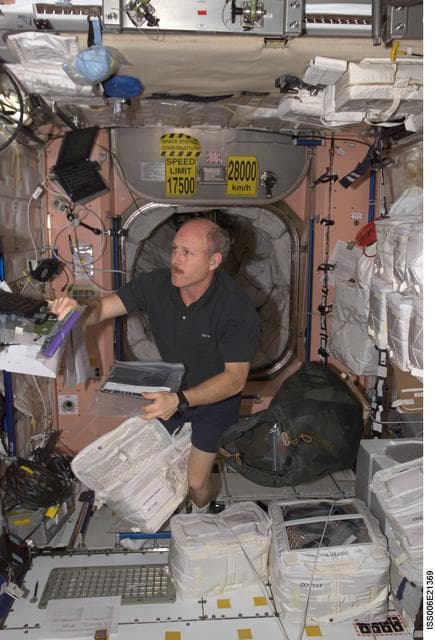 Bowersox works at a laptop computer in Node 1 during Expedition Six