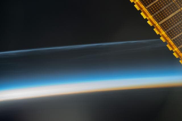 Noctilucent clouds illuminated when the sun is below Earth's horizon