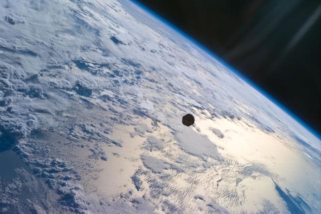 PANSAT satellite deployment from STS-95 Discovery's payload bay