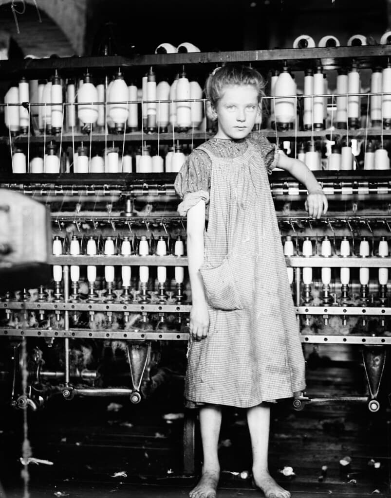 Child Labor: Barefoot Girl in Factory.