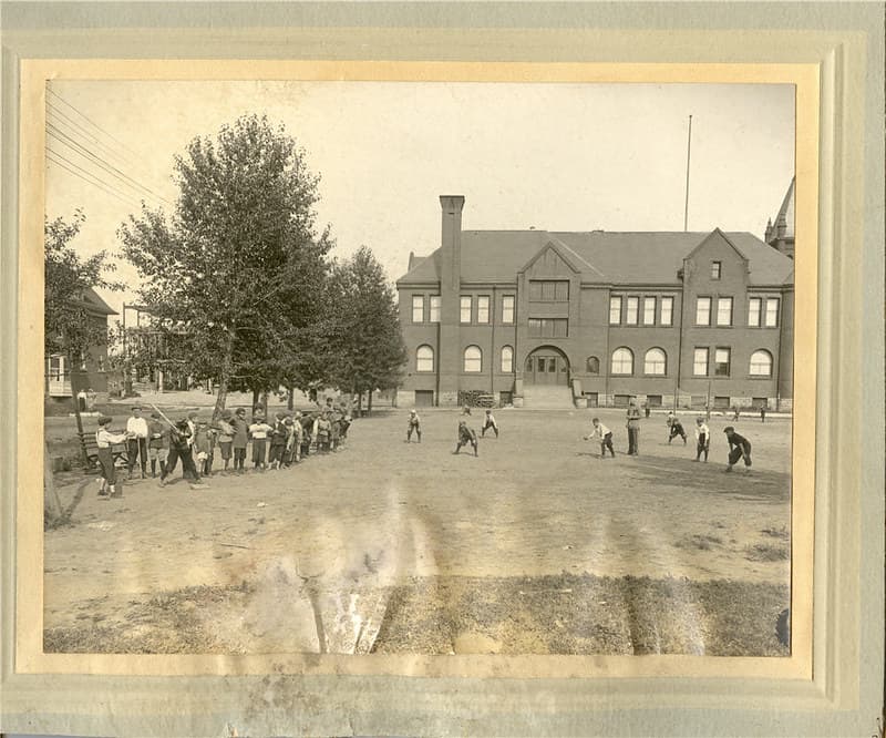 City Champion Team playing baseball in front of Central School