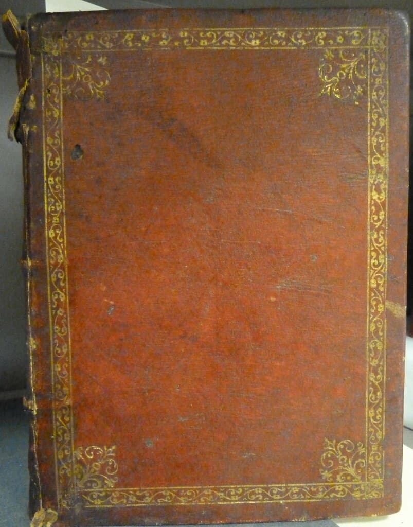 Full red morocco binding with gold-tooled borders and corner ornaments