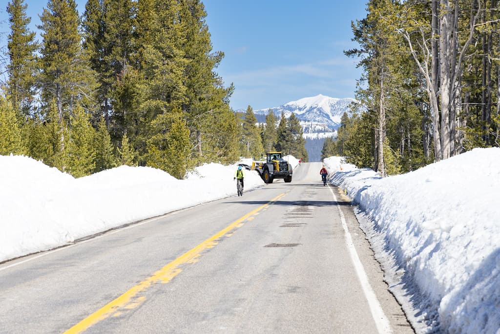 Spring biking with heavy machinery on the road
