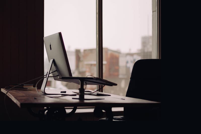 Apple iMac on Desk by Window