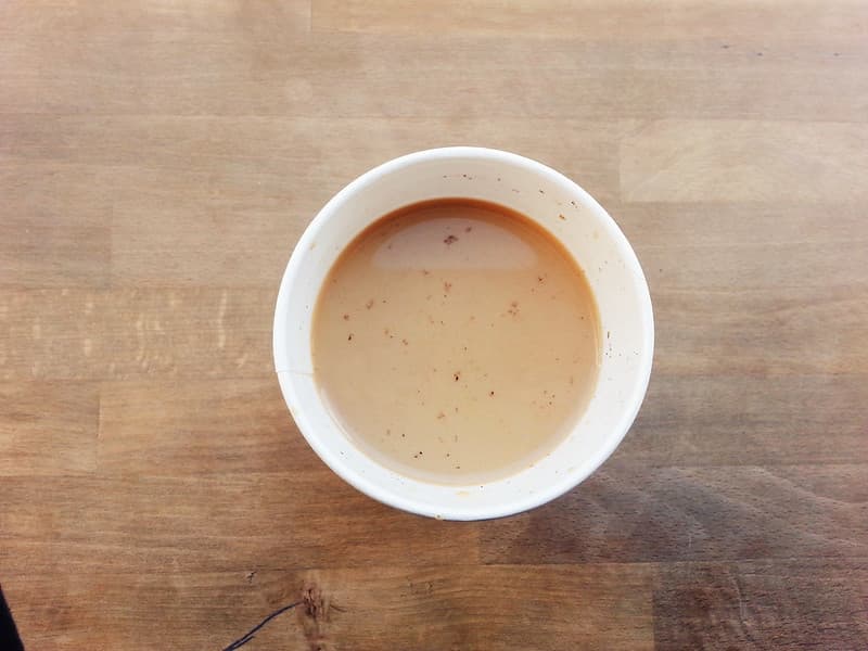 Coffee in Cup on Wood Tabletop