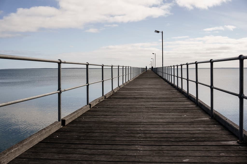 People on Pier with Wooden Deck